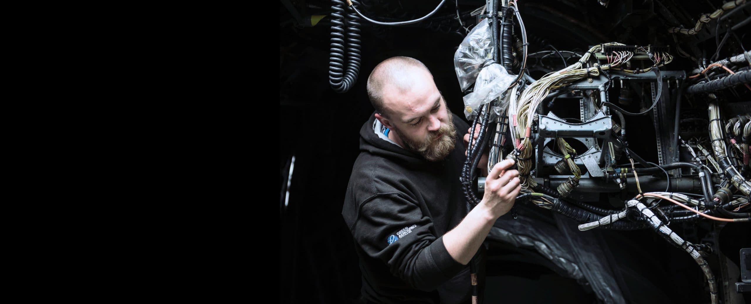 Technician inspecting aircraft components before despatch